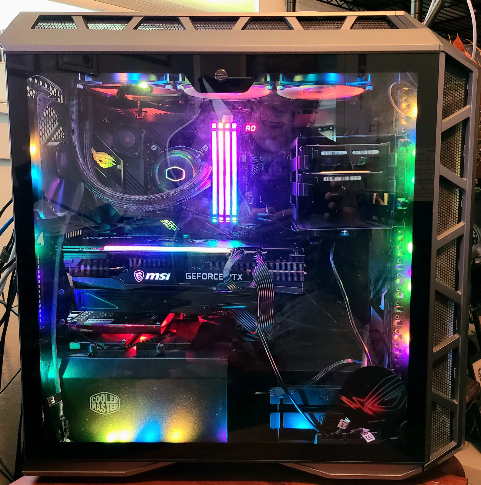 Todd's own desktop — a Cooler Master tower with liquid cooling, RGB memory and an MSI GeForce RTX graphics card behind a glass side panel